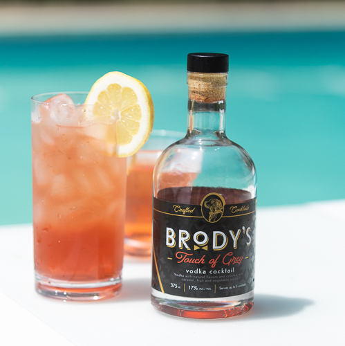 Brody's Touch of Grey vodka cocktail poured over ice with a lemon wheel, served poolside